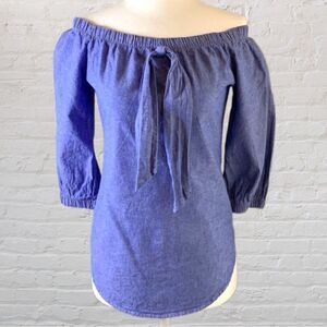 MIA off shoulder denim blue color mid length sleeve blouse. Decorative tie